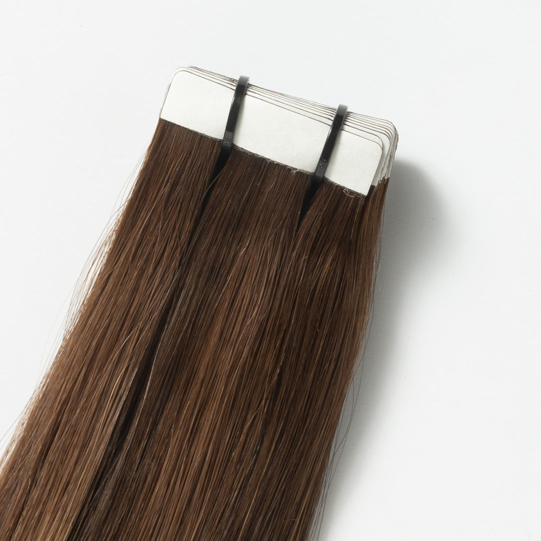 Close-up of Warm Brown Balayage (2+7) Veloura Tape-in human hair extensions, showing quality & blend.