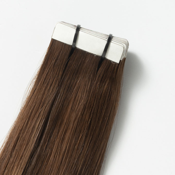 Close-up of Warm Brown Balayage (2+7) Veloura Tape-in human hair extensions, showing quality & blend.
