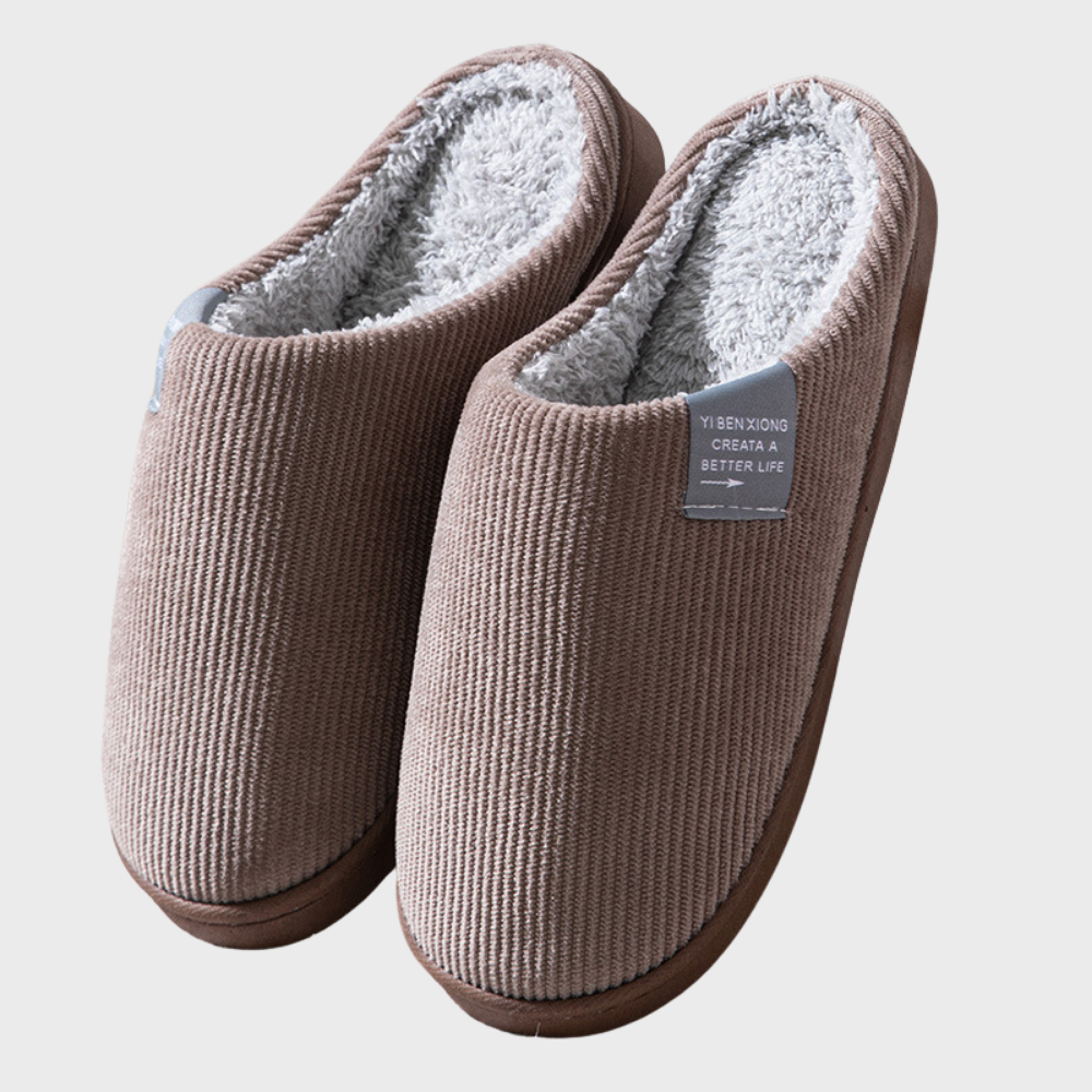 Warm women's house slippers with a non-slip sole, ensuring comfort and safety indoors.
