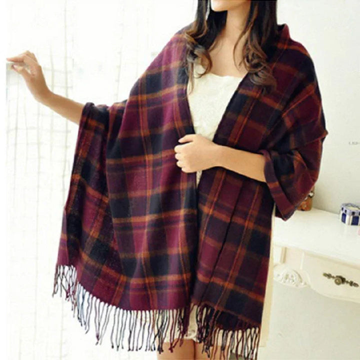 Women's cashmere scarf with an intricate check pattern, combining comfort and high fashion.