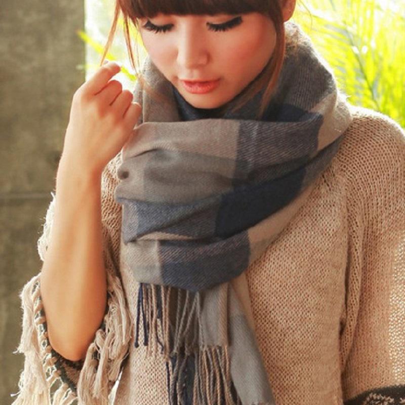 Designer women's cashmere check scarf, a luxurious and cozy addition to winter fashion accessories.