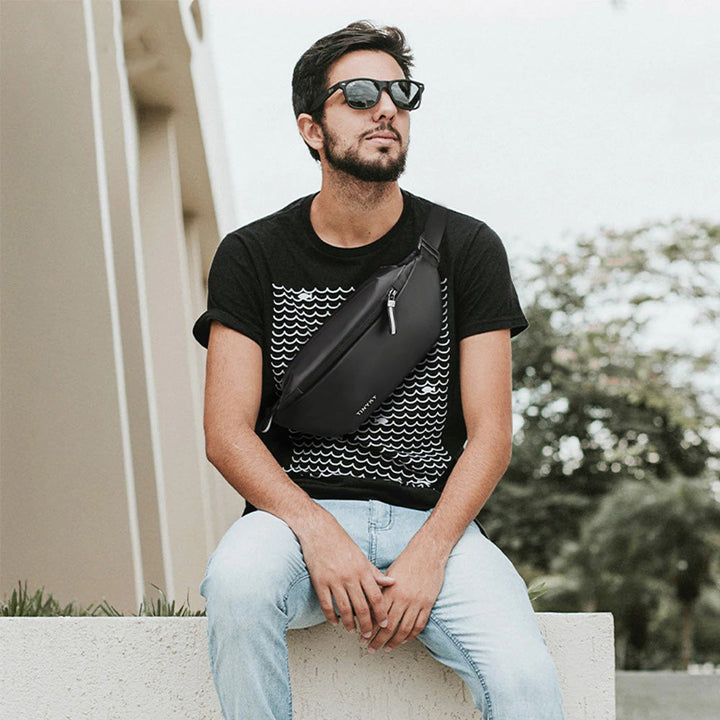 Durable water-resistant waist bag with multiple pockets for secure outdoor essentials.