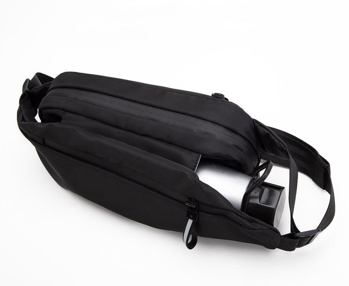 Secure multi-pocket fanny pack, water-resistant design for active travel & outdoor use.
