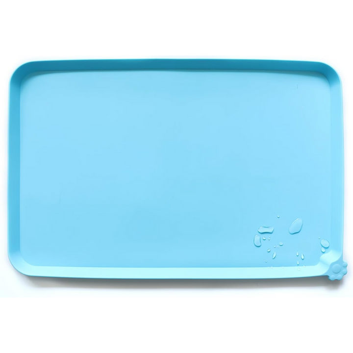 Waterproof pet feeding mat in blue, with spill-proof raised walls, ideal for messy eaters