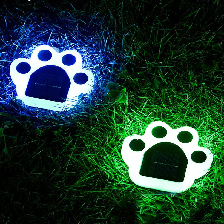 Charming wireless solar paw print LED lights decorate outdoor gardens and pathways, energy-efficient and automatic.