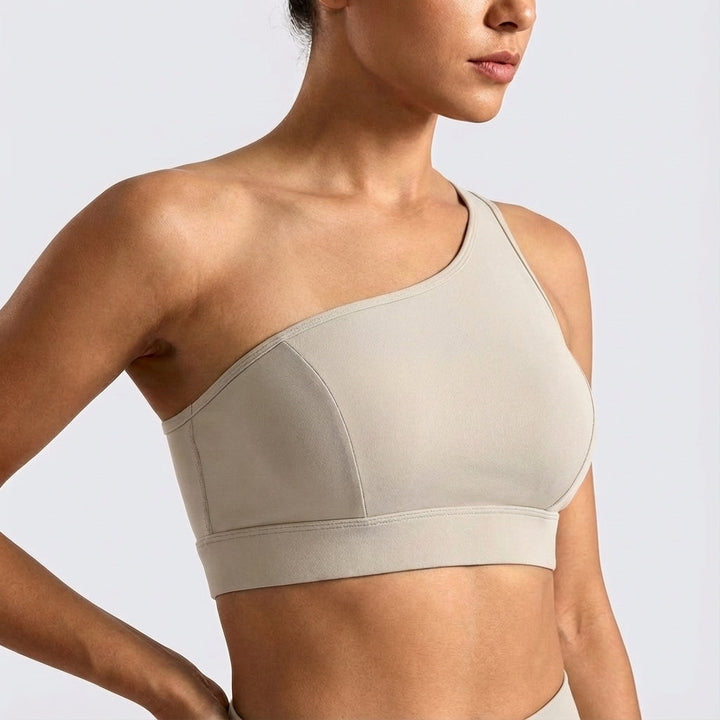 Asymmetrical workout top for women, black, comfortable and breathable performance activewear.