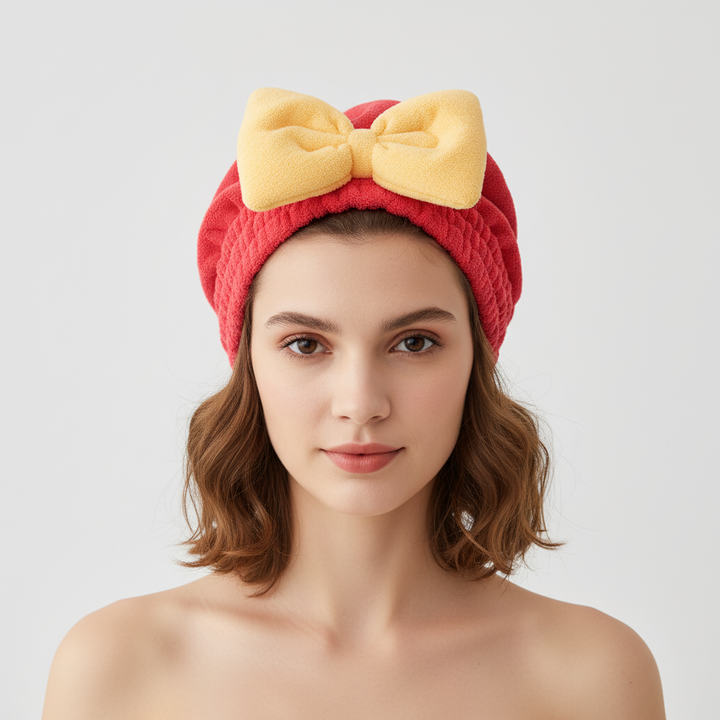 Overhead view of a person wrapping their wet hair in a super absorbent microfiber hair towel for fast drying.