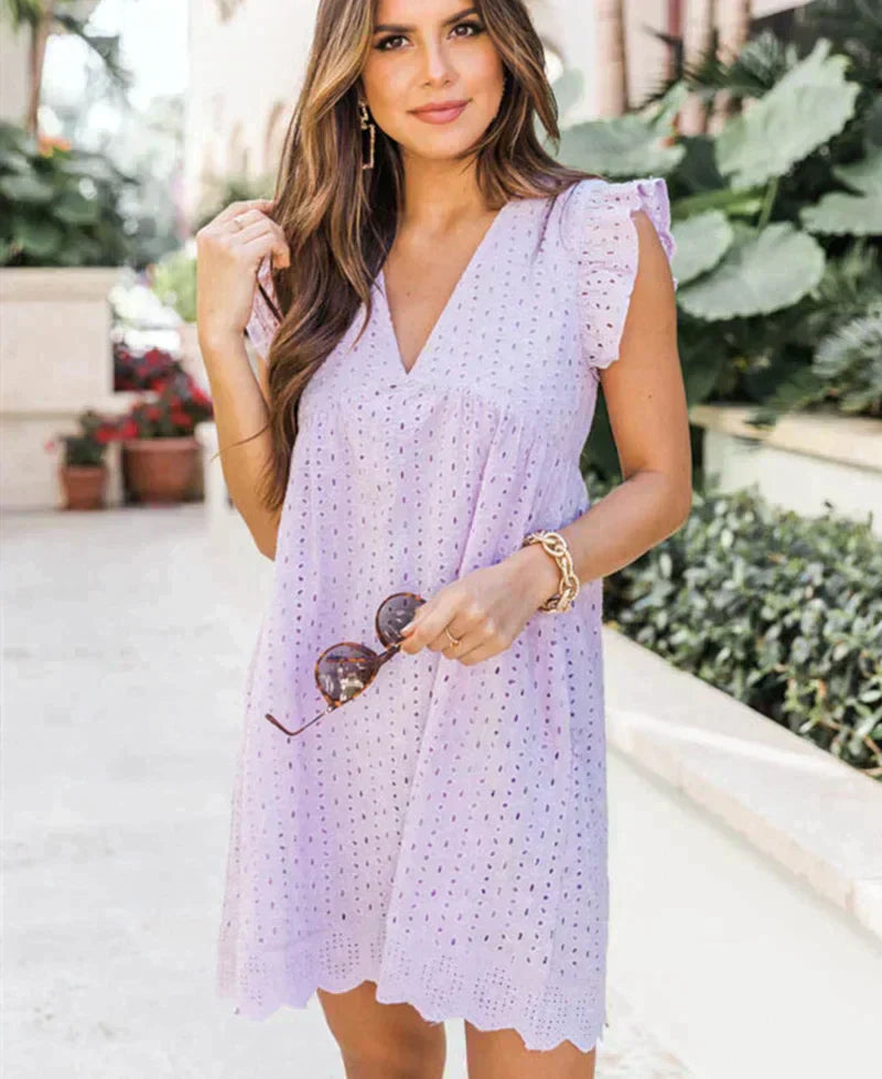 Casual women's summer dress, a 2-in-1 design with built-in shorts, V-neck, and essential pockets.