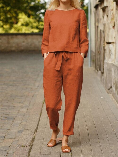 Comfy women's two-piece set featuring a relaxed round neck shirt and elastic waistband trousers. Perfect Nia outfit.
