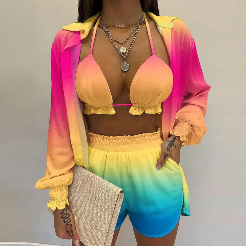 Trendy women's 3-piece tropical swimsuit with a halter bikini top, adjustable shorts & sheer cover-up.