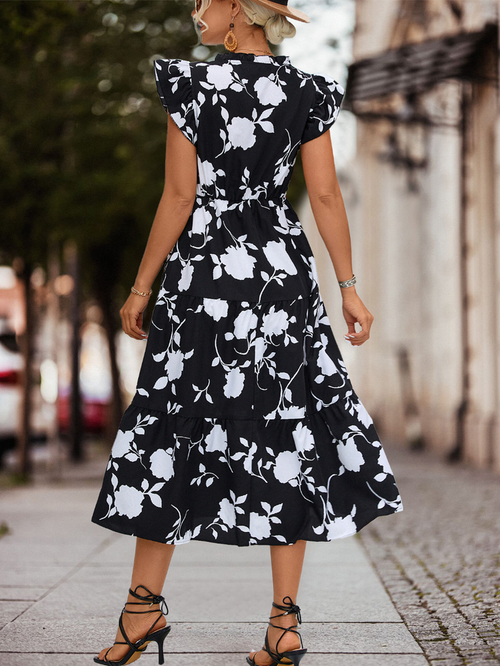Elegant women's A-line summer dress with puff sleeves & chic color accent, ideal for parties.