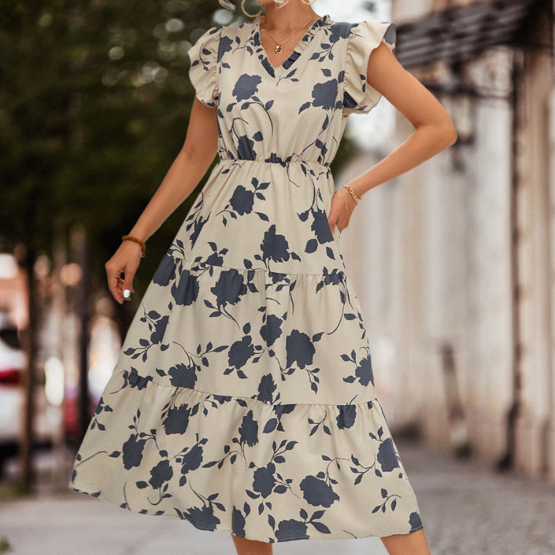 Flowy A-line summer dress for women, featuring trendy puff short sleeves and a distinct color detail.