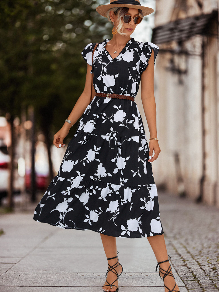 Fashionable women's A-line midi dress, summer-ready with elegant puff sleeves & a vibrant color accent.