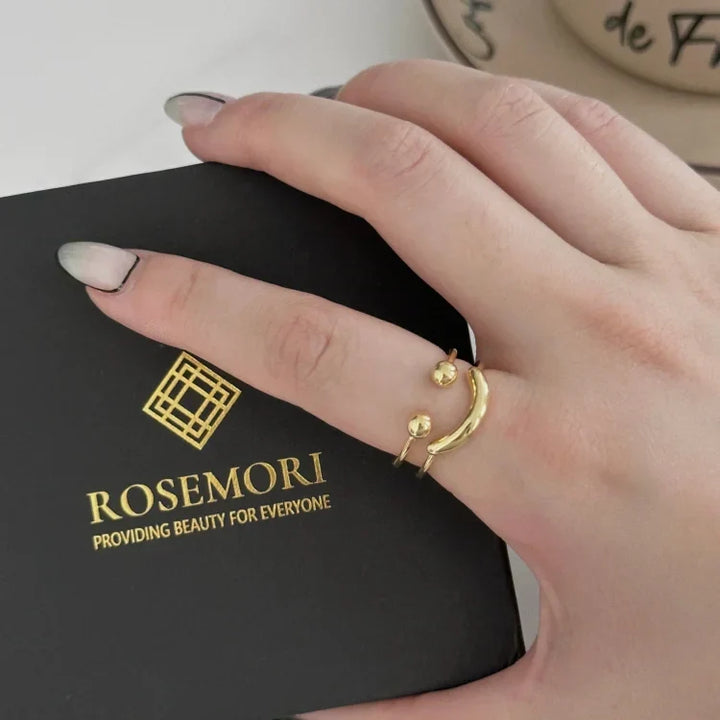 Statement gold smiley ring, an adjustable women's jewelry piece adding a touch of joy and modern style.
