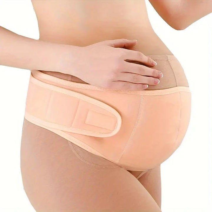 Adjustable pregnancy belly support band in pink, offering crucial back & abdominal support for expectant mothers.