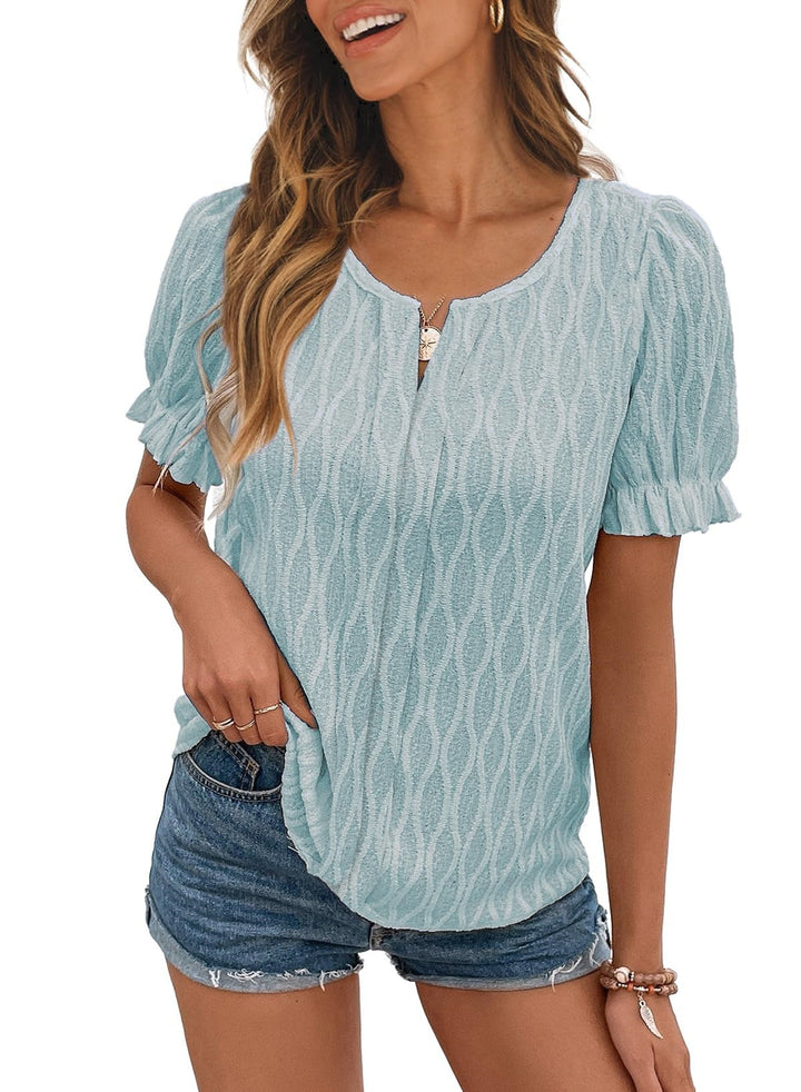 Model wears women's airy puff sleeve blouse with lace accent, styled for a chic summer look.
