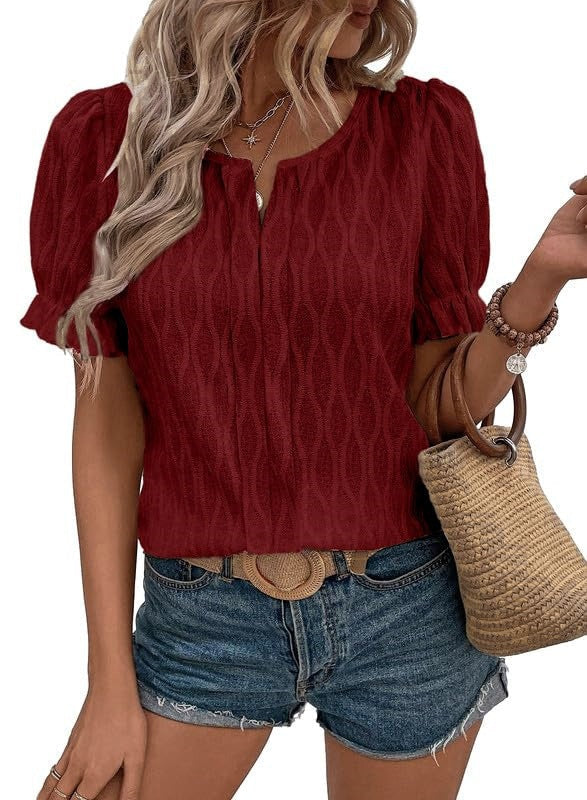 Feminine women's short sleeve lace top with airy puff sleeves, enhancing any spring or summer outfit.
