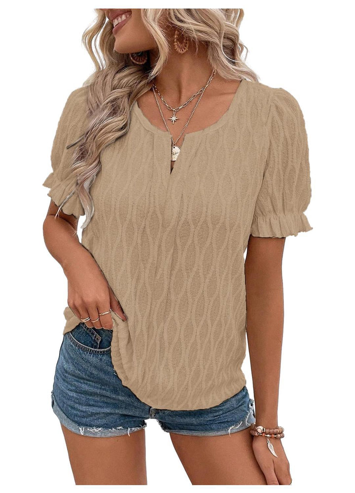 Women's puff sleeve blouse styled casually with jeans, perfect for spring or summer outings.