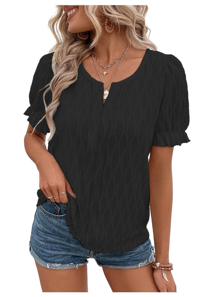 Voluminous puff sleeve detail on the women's airy blouse, a key feminine fashion element.