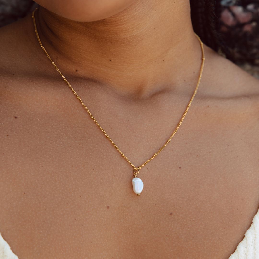 Women's Anisa baroque freshwater pearl pendant necklace with a gold-tone chain.