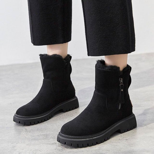 Women's apricot waterproof winter boots, warm and cozy for cold weather outdoor adventures.