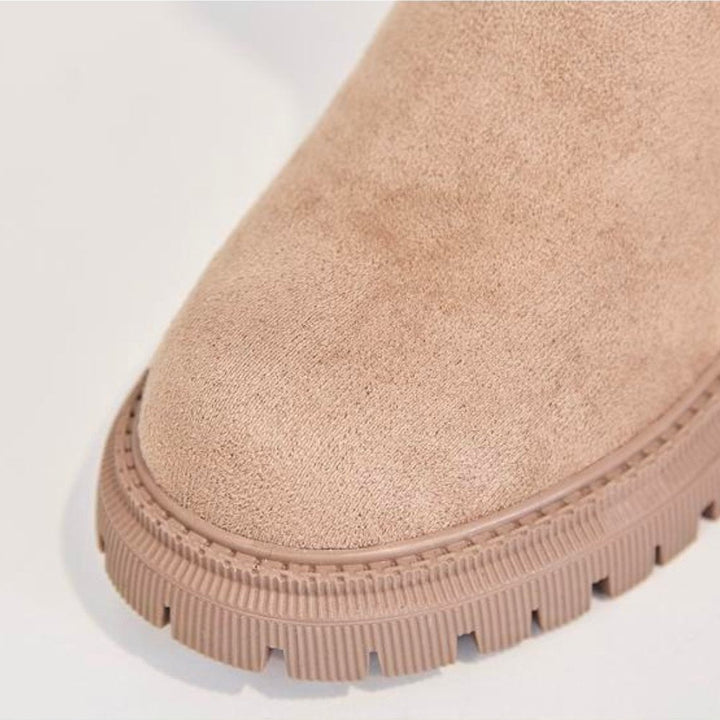Women's warm winter boots in apricot, offering waterproof protection and comfortable support.