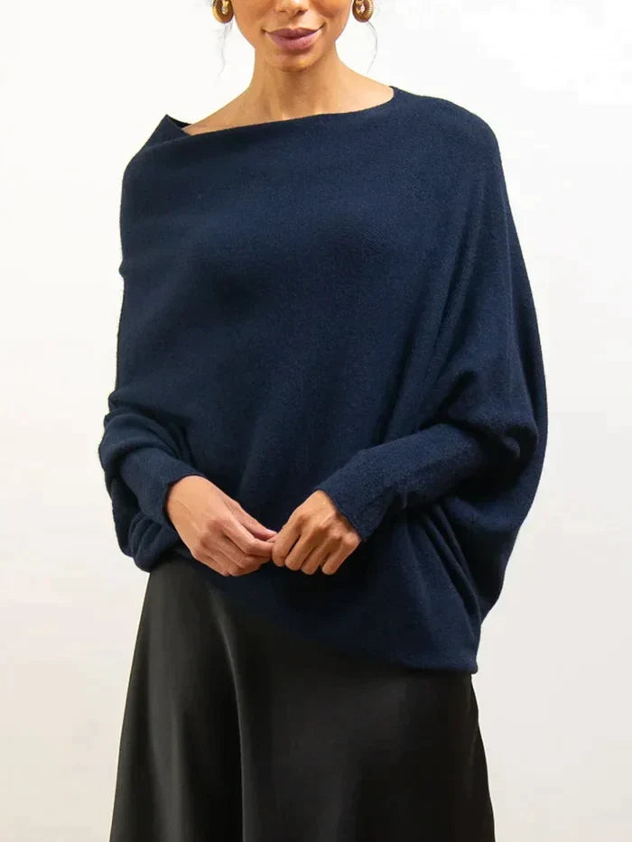 Women's oversized sweater featuring an asymmetric hem and loose fit, ideal for cozy comfort.