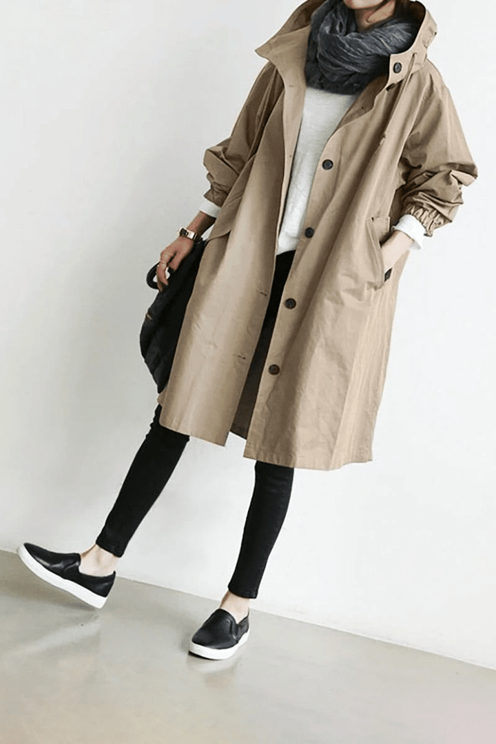 Aurora women's lightweight rain jacket, water-resistant and packable, great for travel & sudden showers.