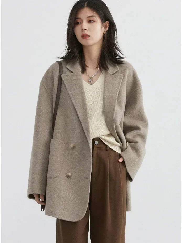 Cozy women's Aurora reversible winter coat. Stylish and warm wool outerwear, ideal for chilly fall & winter days.