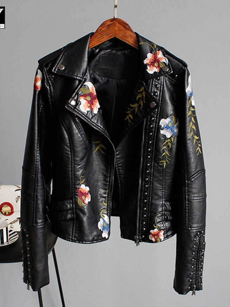 Fitted women's cropped faux leather jacket with a chic zipper, making a bold statement for urban and casual wear.