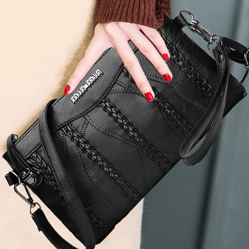 Stylish women's PU leather crossbody bag, versatile clutch with ample storage, side view