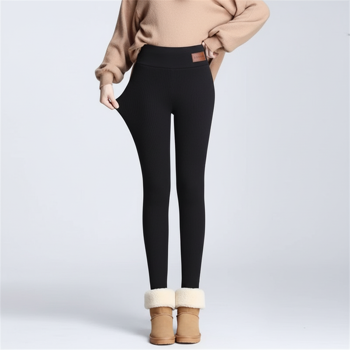 Stylish women's high-waist thermal leggings in black, offering a comfortable and warm fit.