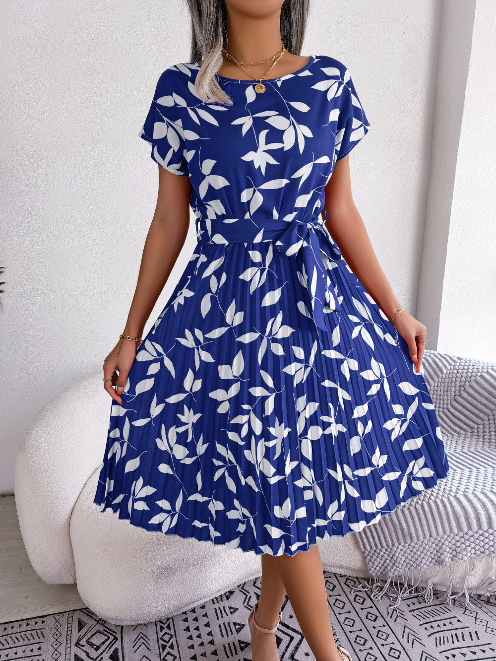 Women's blue printed midi dress with short sleeves, perfect for casual summer elegance. Versatile fashion.
