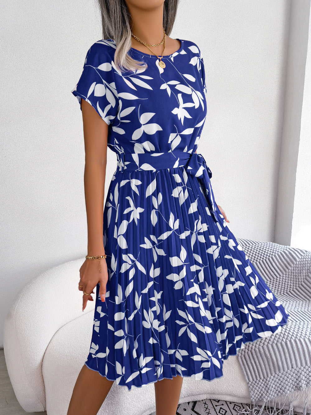 Back view of women's blue printed short sleeve midi dress, a stylish and comfortable choice for summer casual wear.