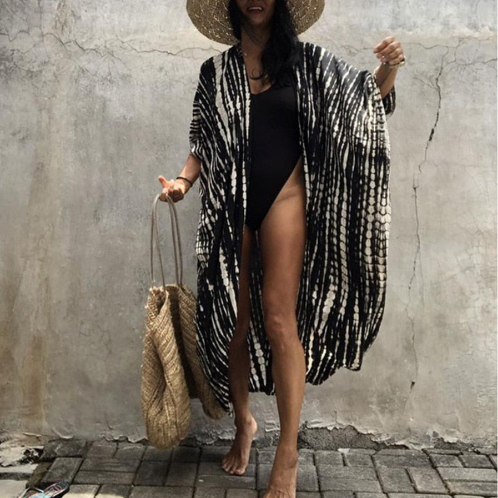 Women's boho beach blouse with flowy kimono sleeves, perfect for summer vacation and stylish cover-up.