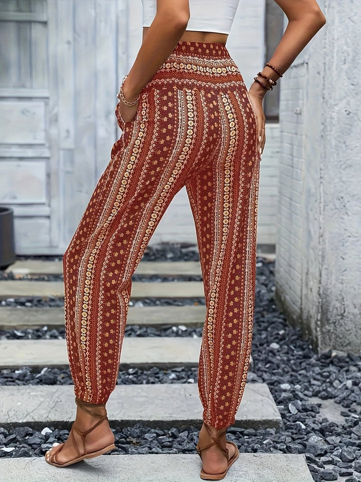 Chic high-waist women's trousers with a boho print & smocked waist, great for trendy casual loungewear.
