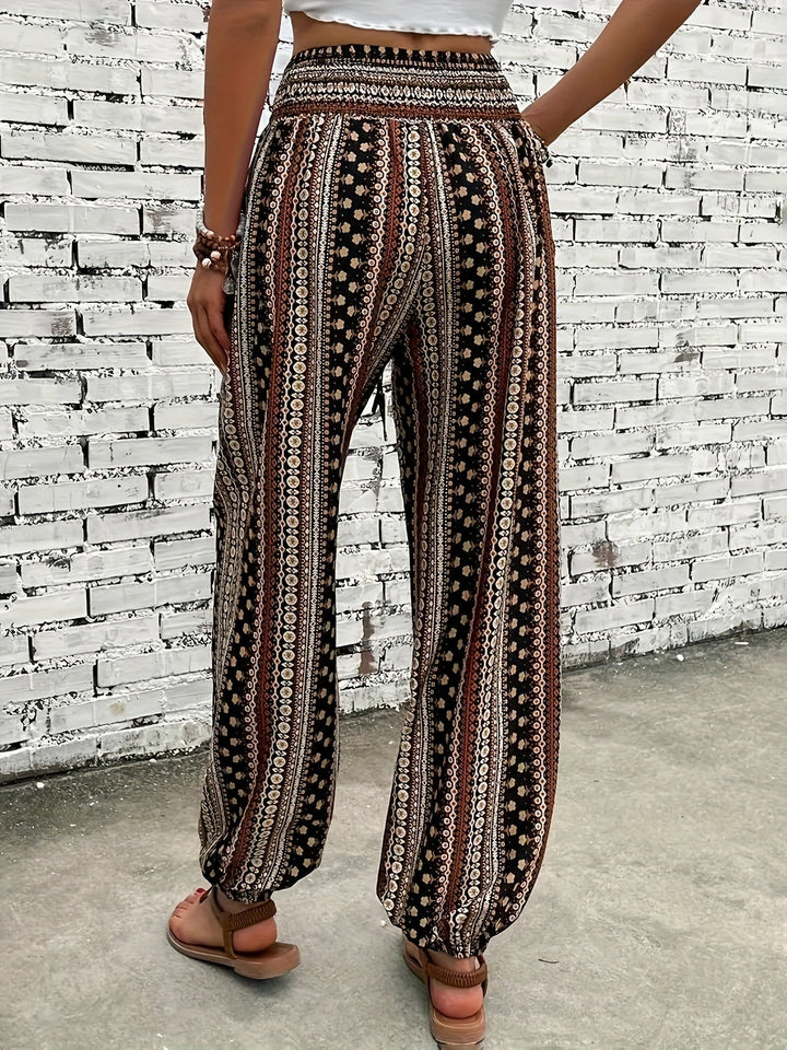 Comfortable women's boho printed pants, featuring a high waist & smocked design, suitable for any casual look.