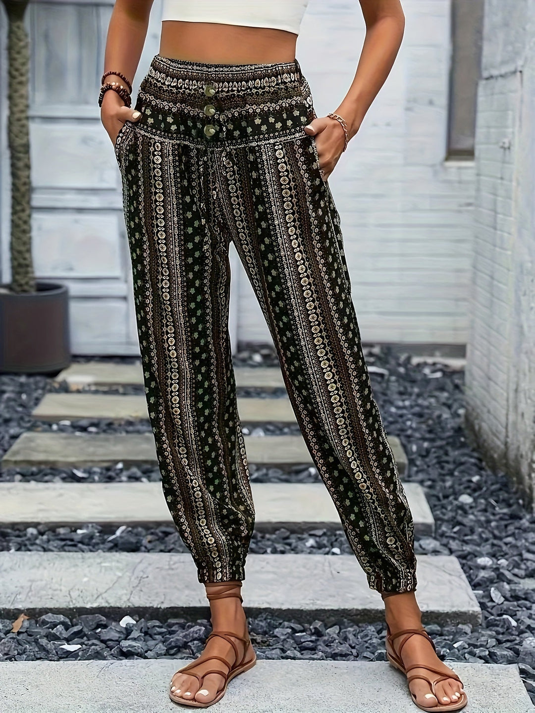 Stylish women's printed boho pants featuring a high waist & smocked elastic band, ideal for casual wear.