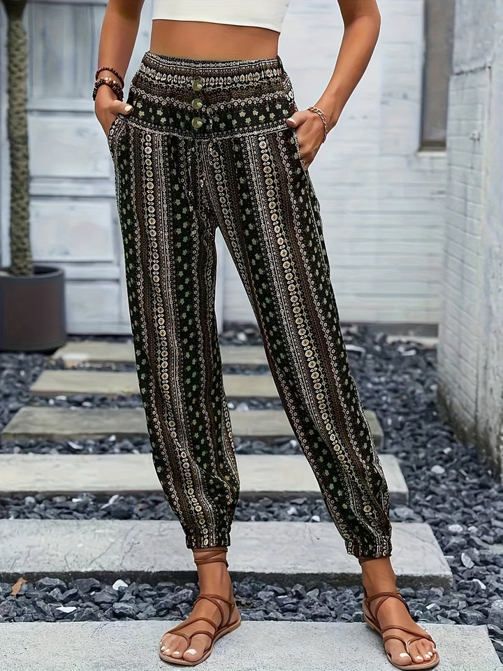 Stylish women's printed boho pants featuring a high waist & smocked elastic band, ideal for casual wear.