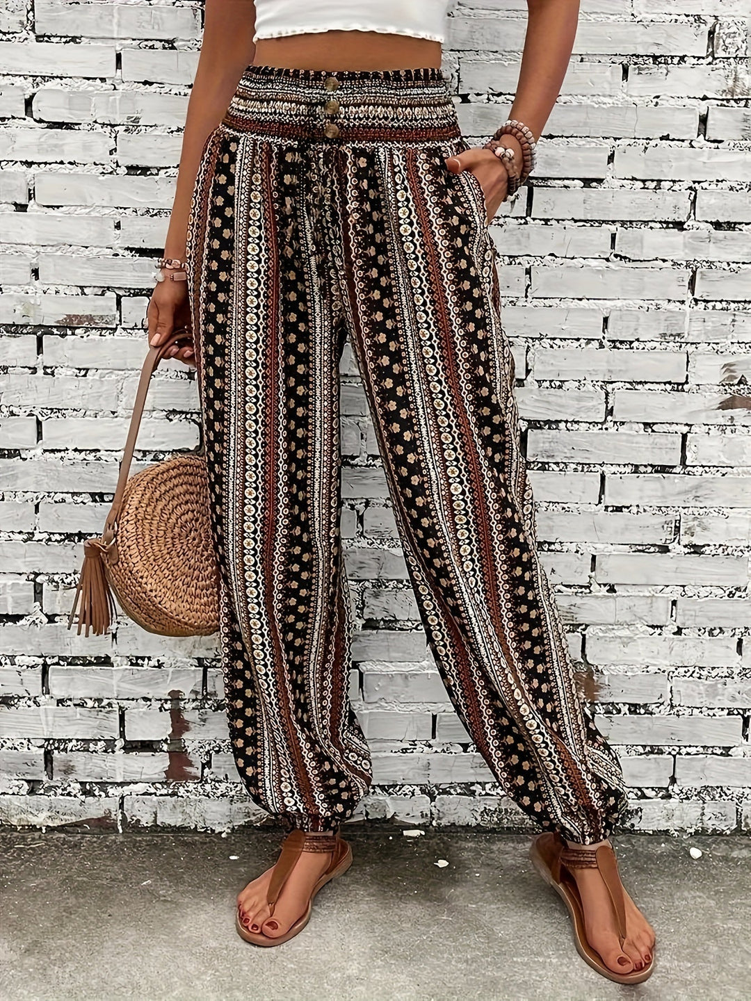 Trendy high-waist boho trousers for women, showcasing a unique print & flattering smocked waistband.