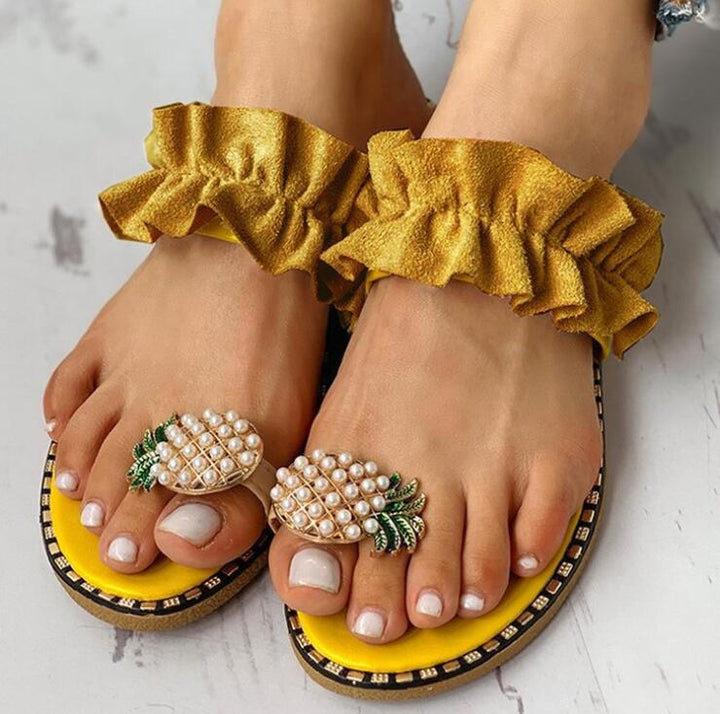 Woman wearing white Women's Boho Orthopedic Comfort Sandals on a beach, walking shoes