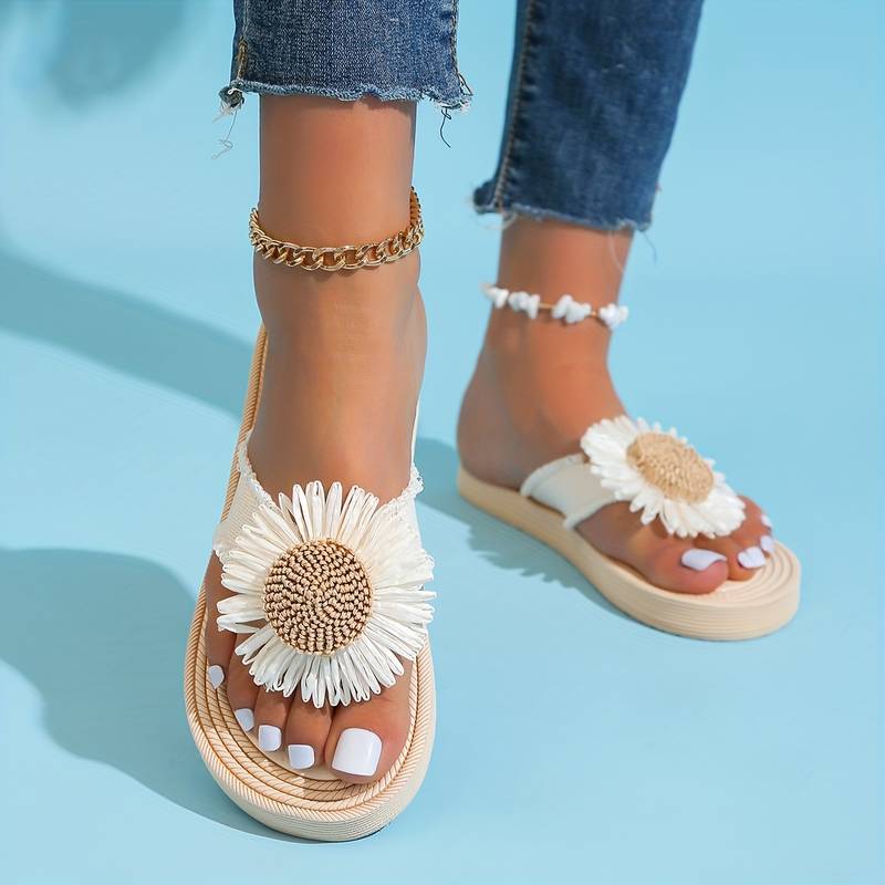 Marivi women's boho slip-on flat sandals. Adorable daisy accent adds effortless style to these comfortable summer slides.