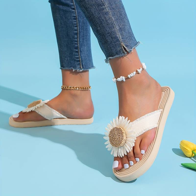 Lightweight women's boho slip-on sandals with daisy detail. Flat, comfortable, and stylish for summer casual wear.