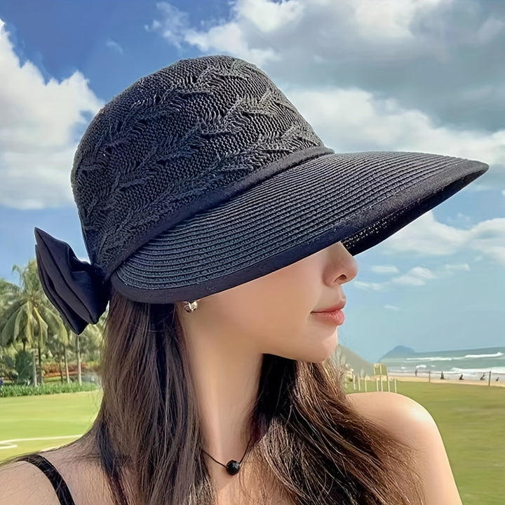 Classic braided women's sun hat with a sophisticated bow accent, essential for summer outfits.