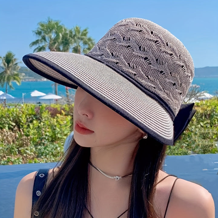 Hand-braided women's summer hat with a charming bow, perfect for beach trips and sunny days.