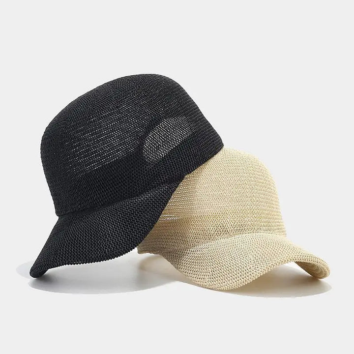 Fashionable women's braided sun hat with a wide brim, perfect for summer beach wear.