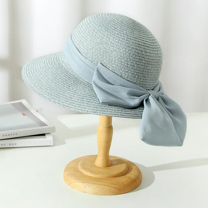 Lightweight and breathable women's summer hat with a fashionable bow, essential for warm weather and travel.