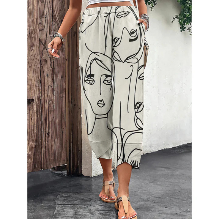 Women's casual beige wide-leg summer trousers featuring a comfortable elastic waist, perfect for relaxed everyday wear.