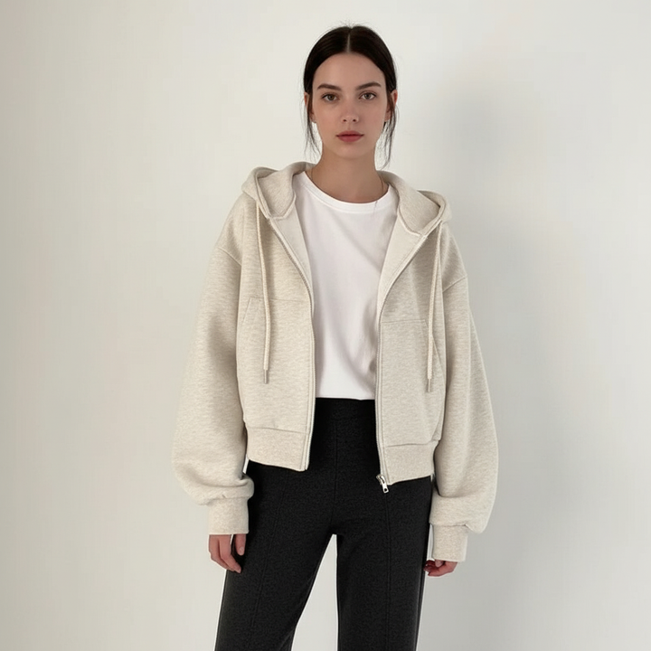 Woman wearing a fashionable oversized hooded vest jacket, styled for outdoor comfort