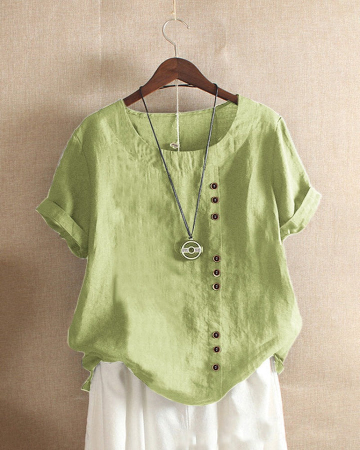 Close-up texture of a women's casual short sleeve round neck blouse, highlighting quality.